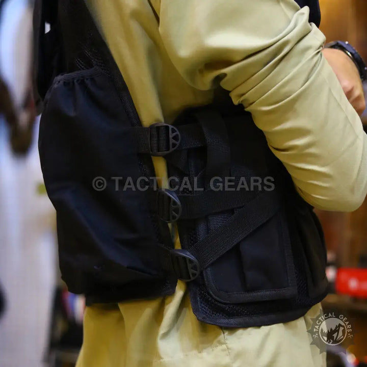 Black tactical military vest with multiple pouches and adjustable straps for tactical military use