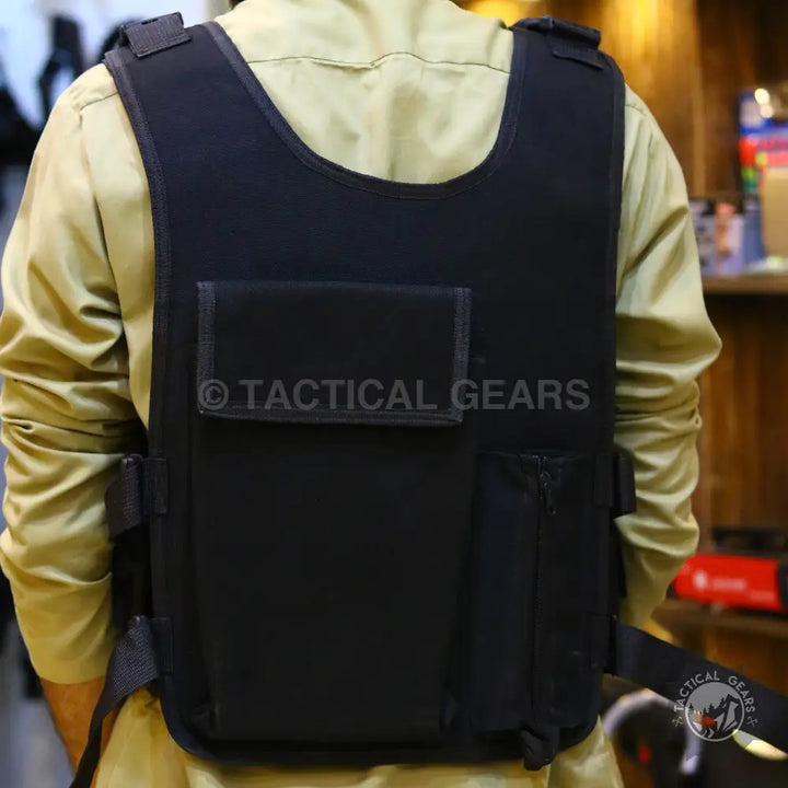 Black ballistic vest with armor plate and 8 pockets for tactical military use