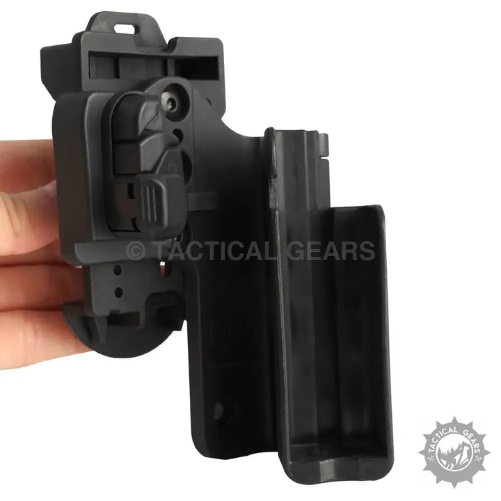 Black polymer pistol holster with magazine pouch for Glock 17,19,22 featuring spring loaded design and active retention