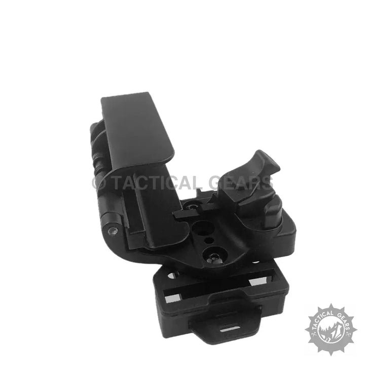 Black polymer tactical holster with spring loaded design for quick cocking and active retention