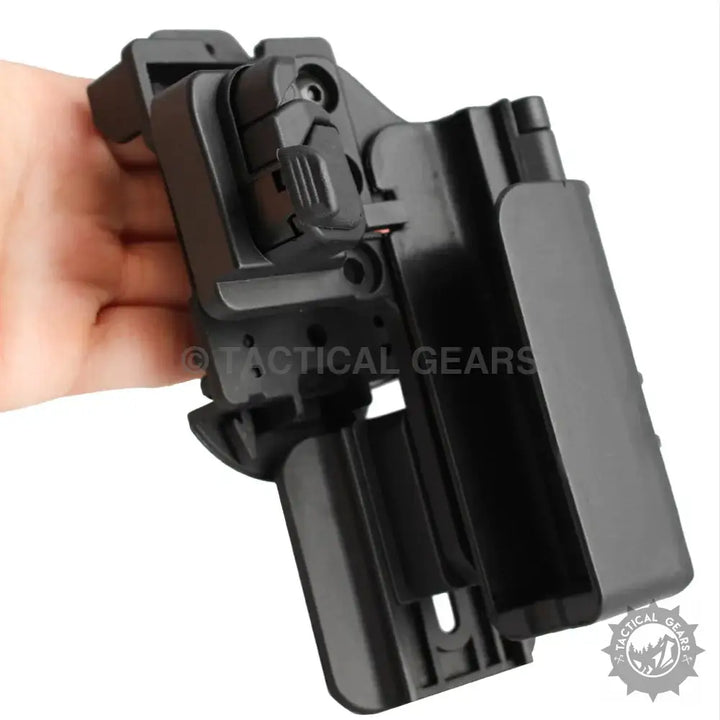 Black modular quick cocking holster with active retention and spring loaded design for Glock models