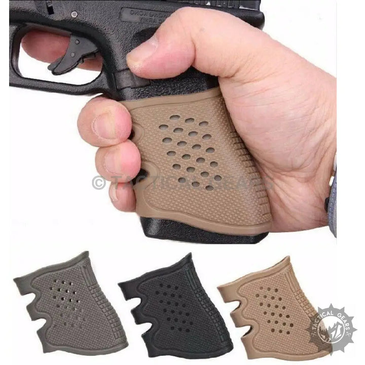 Person holding pistol with textured tan rubber grip in Rubber Grip Pack with black and gray grips