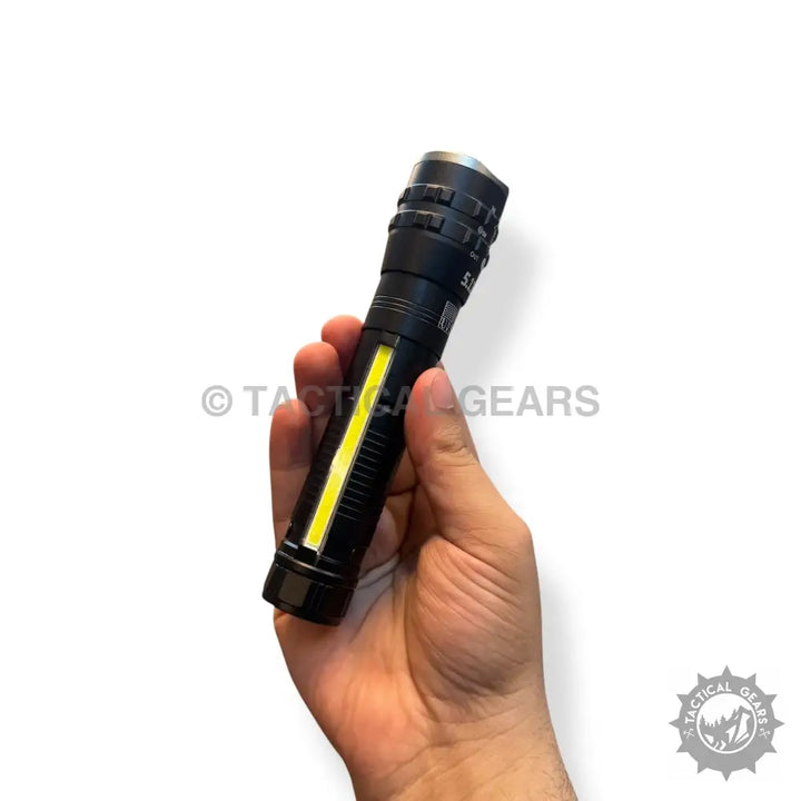 Hand holding Tactical Pocket Flashlight 1km Range with black cylindrical design and yellow LED