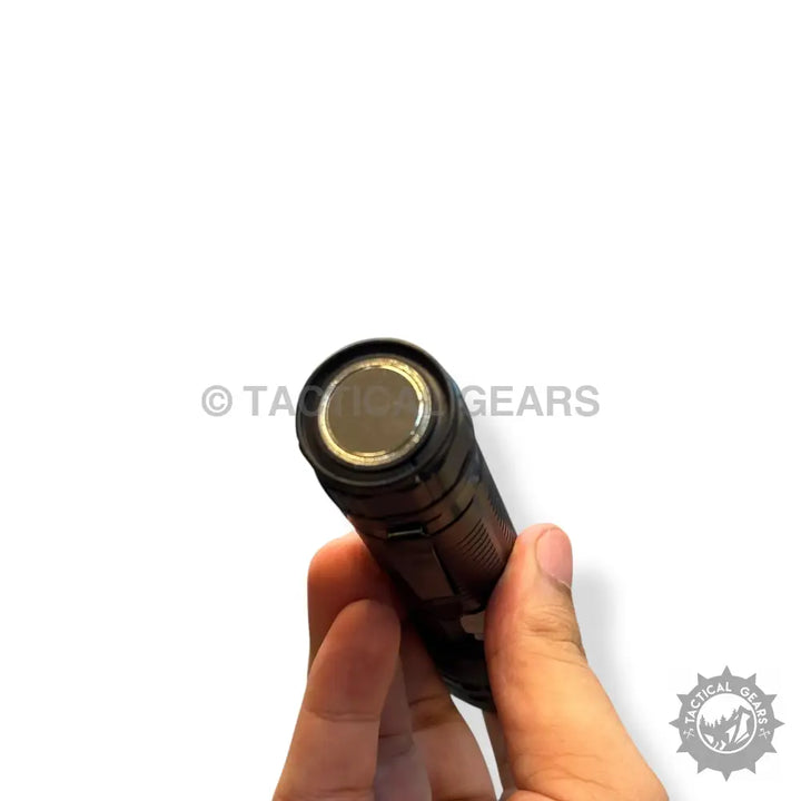 Black tactical pocket flashlight with metallic reflector showcasing 1km range for tactical use