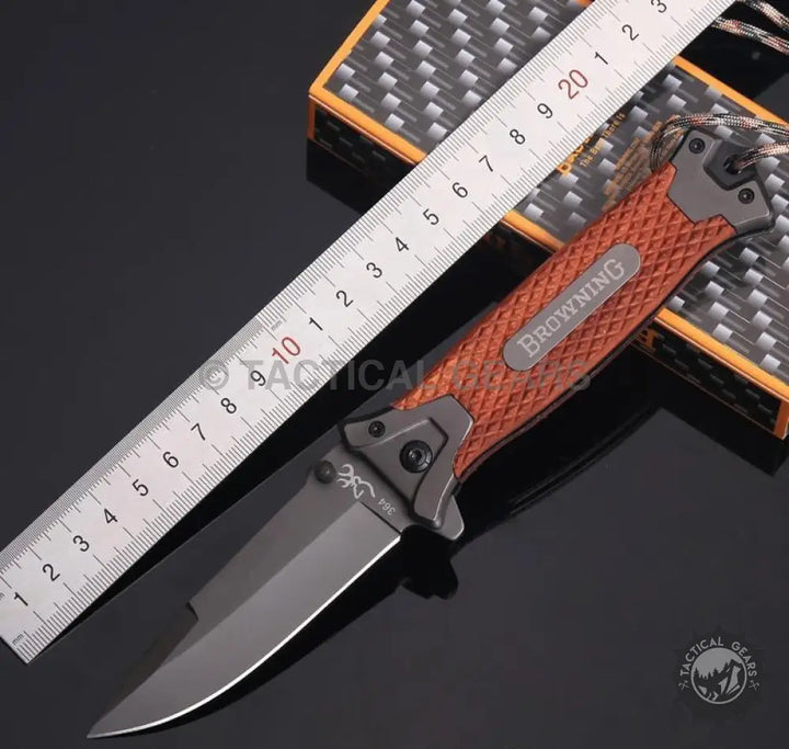 Browning 364 folding knife with rosewood handle and black blade