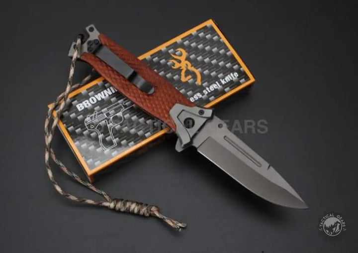 Browning 364 folding knife with rosewood handle, serrated blade