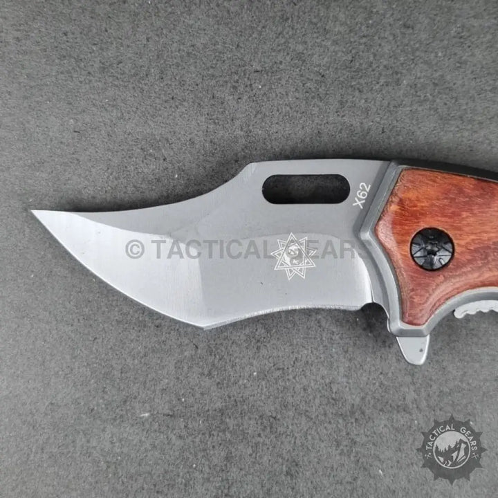 Tactical X62 Karambit folding knife with curved polished blade and wooden handle