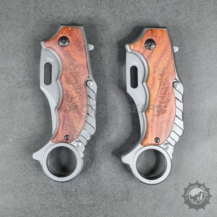 Two Tactical X62 Karambit folding knives with wooden handles for tactical use