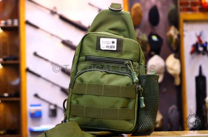 Olive green tactical sling backpack made of durable 600d Oxford fabric for outdoor use