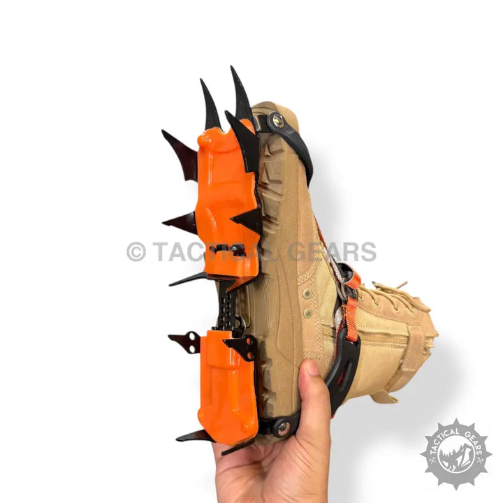 Orange and black ice climbing crampons with secure straps for Tan Tactical Boot