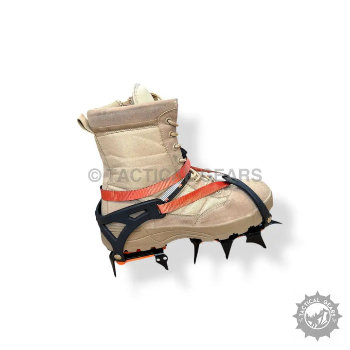 Tan tactical boot with orange and black ice climbing crampons and secure straps for ice climbing
