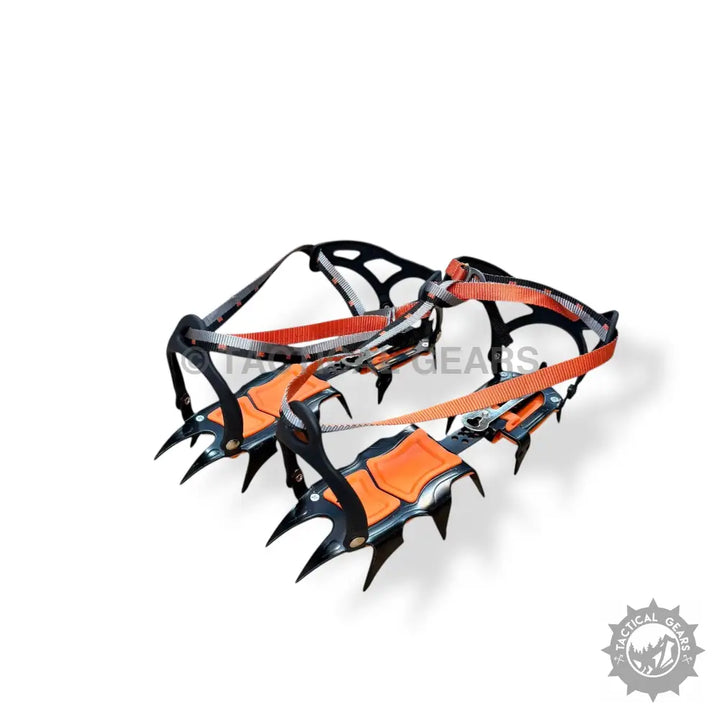 Black and orange ice climbing crampons with sharp spikes and secure straps for ice climbing