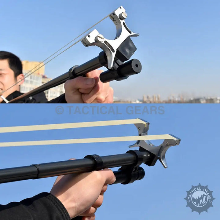 Black telescopic long rod slingshot with silver Y-shaped fork and laser sight attachment