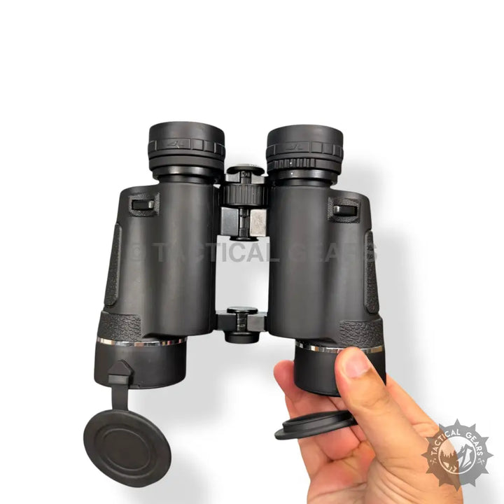 Black Textured Grip Optical 10x50 Binoculars with Lens Caps, held by hand