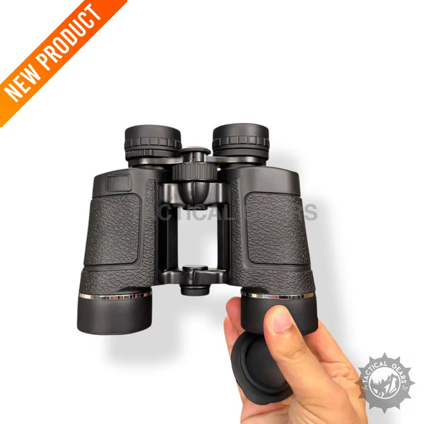 Black Textured Grip Optical 8x42 Binocular held by hand for clear outdoor viewing