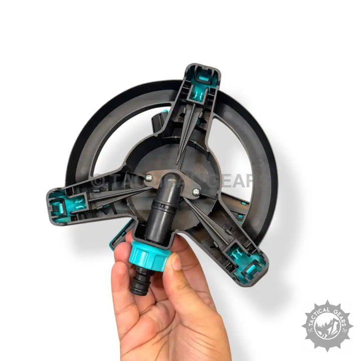 Black and teal plastic gardening sprinkler with adjustable spray and hose connector