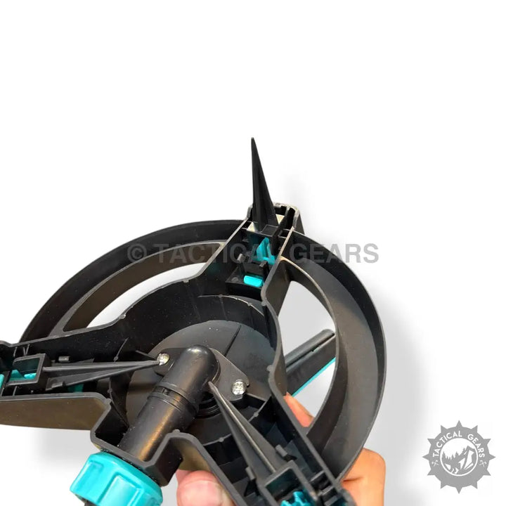 Black and teal plastic gardening sprinkler with adjustable spray and nozzles