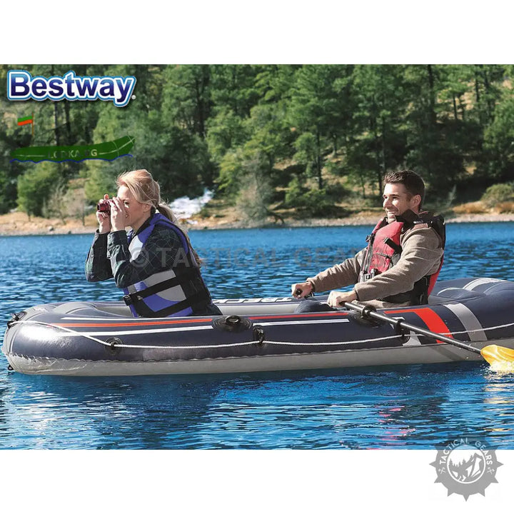Two people in inflatable tender boat with paddles on lake made of puncture resistant PVC with high output pump