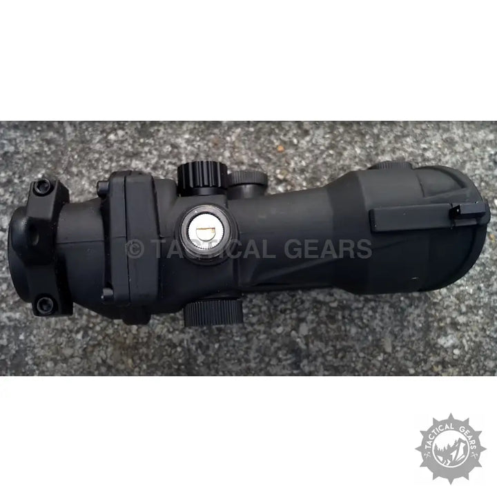Black Trijicon ACOG 4x32 scope with windage and elevation adjustments for rifles