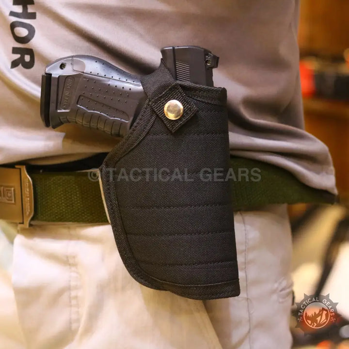 Black fabric universal belt holster with snap closure worn on a belt