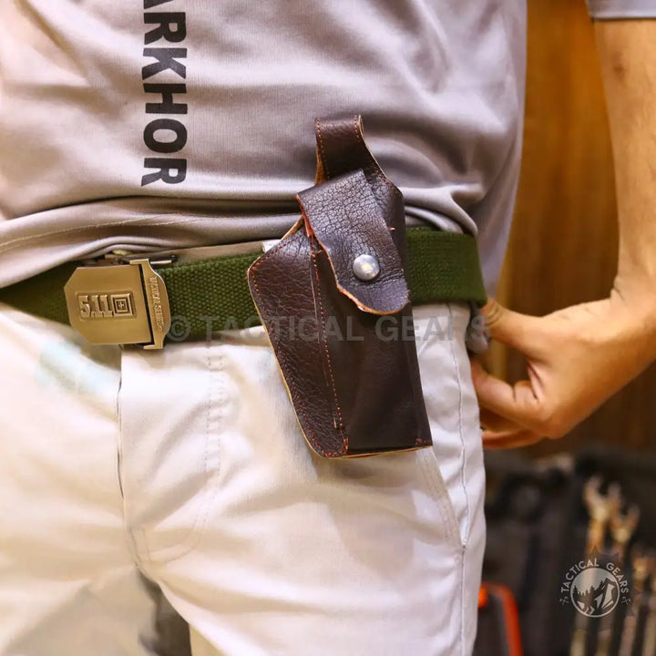 Brown leather tactical belt holster with snap closure for universal belt holster use