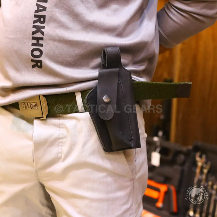 Universal belt holster with strap leather black worn on a tactical belt for concealed carry