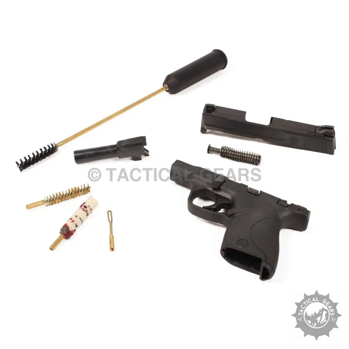 Disassembled handgun with Portable 9mm Cleaning Kit for effective 9mm cleaning