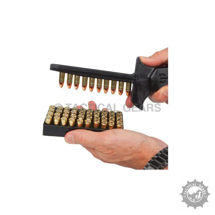 Person using a universal magazine speed loader with ammunition tray for fast reloading
