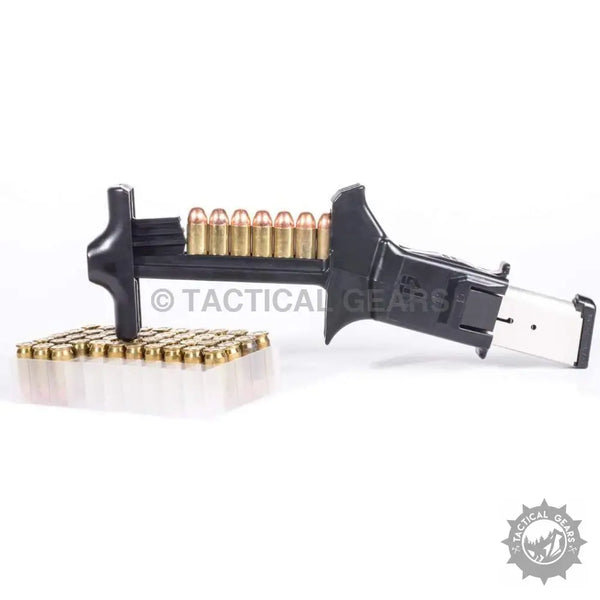 Black universal magazine speed loader with brass ammunition and box of more magazines