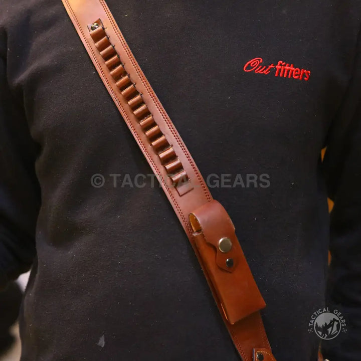 Brown leather shoulder holster with cartridge loops and pouch for versatile concealment