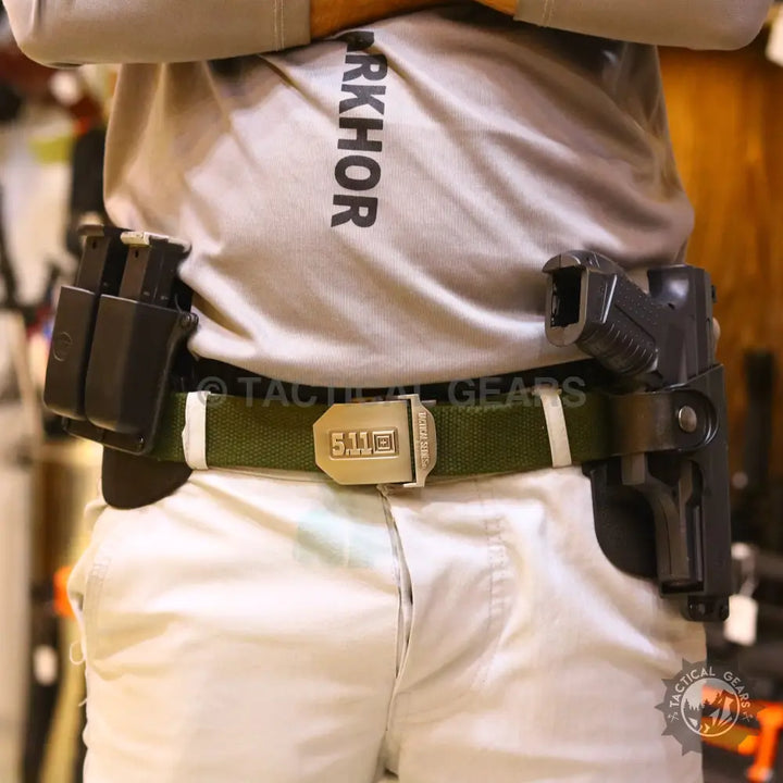 Universal polymer holster with magazine pouch worn on tactical belt for concealed carry