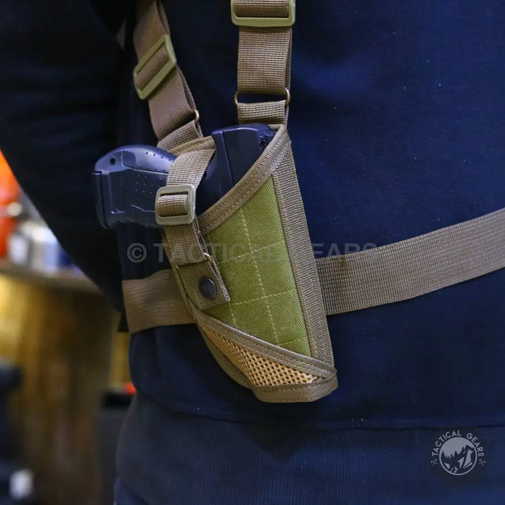 Olive green tactical shoulder holster with magazine pouches and pistol for concealed carry
