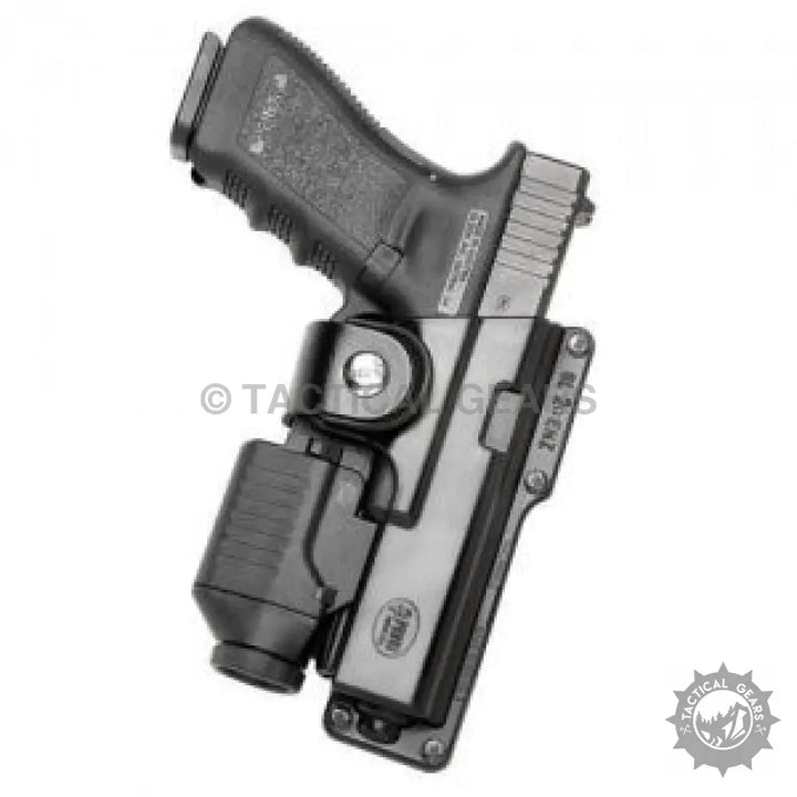 Black pistol in universal tactical polymer holster with internal rubber insert and flashlight