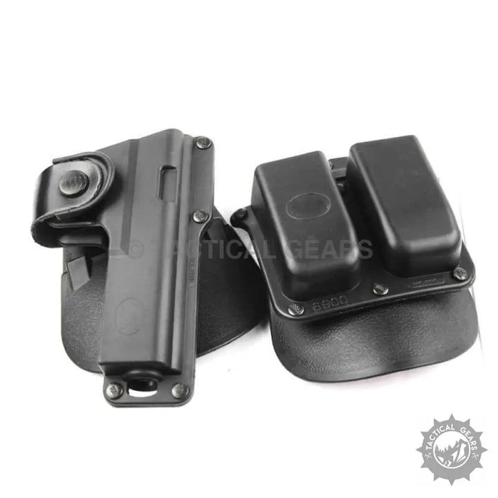 Black polymer pistol holster with dual magazine pouch and internal rubber insert for universal tactical polymer use