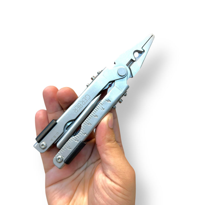 Silver USA Multifunctional Plier Tool with pliers, ruler, and tools in hand, USA lot imported