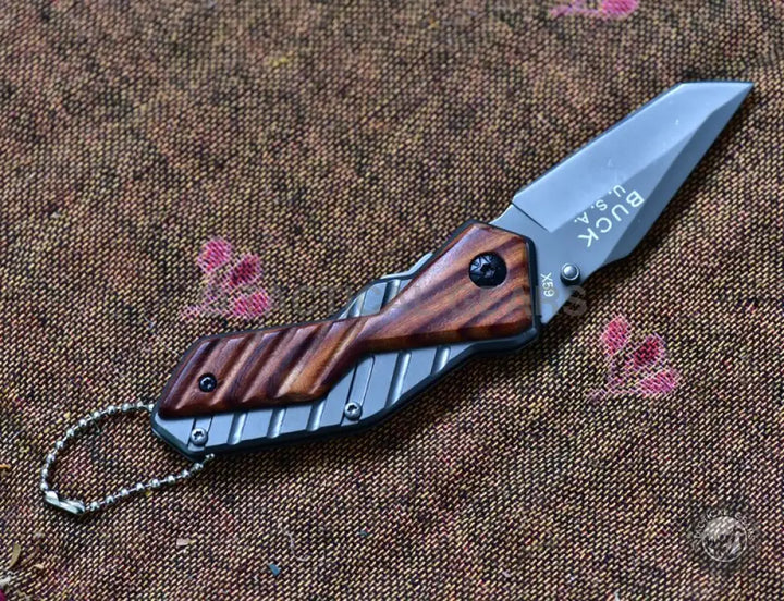 Buck USA X59 Tactical Mini Folding Knife with metal and wood handle and keychain attachment