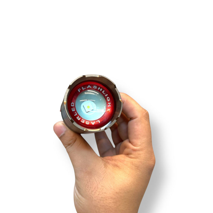 Hand holding a USB Charging LED Tactical Flashlight with red bezel and light blue lens