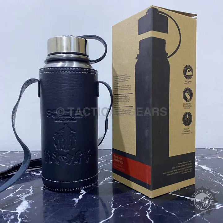 Black leather cover vacuum bottle with stainless steel body and shoulder strap in packaging