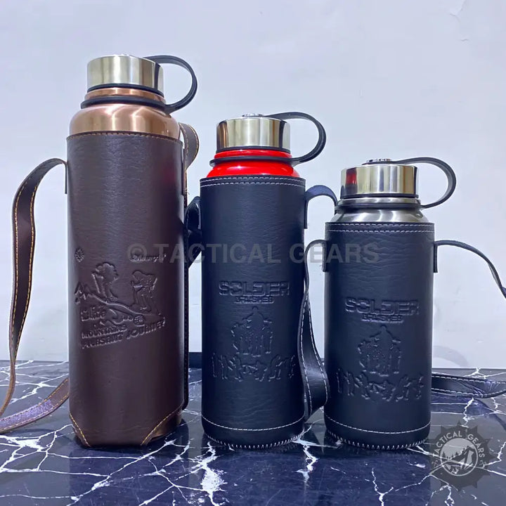 Three insulated vacuum bottles with stylish leather covers for on-the-go hydration