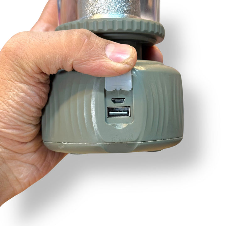 Hand holding portable device with USB-A and micro-USB ports for Vintage Camping Lantern DAT DT-712