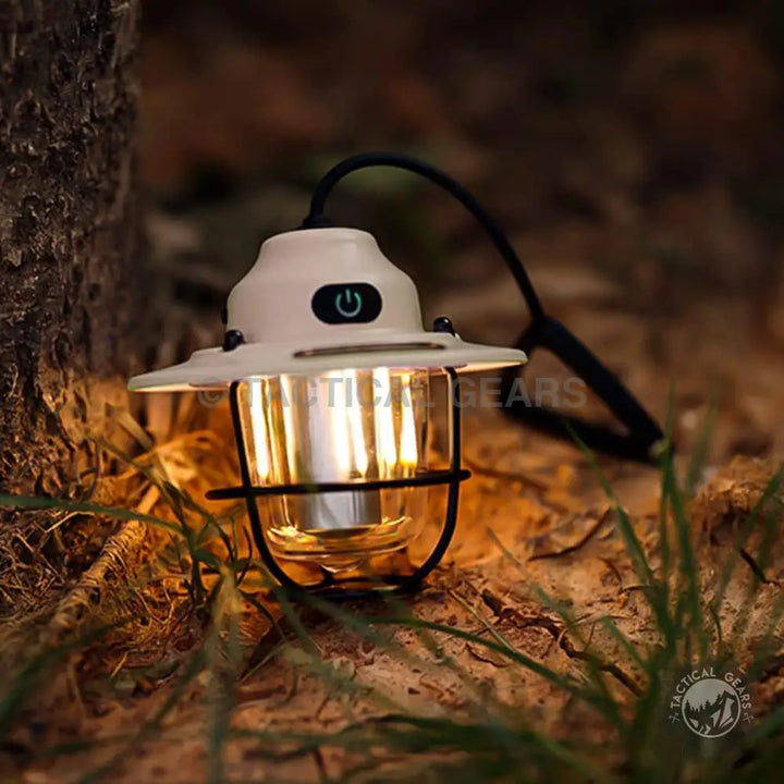 Cream-colored vintage-style camping lantern with black power button and bright light