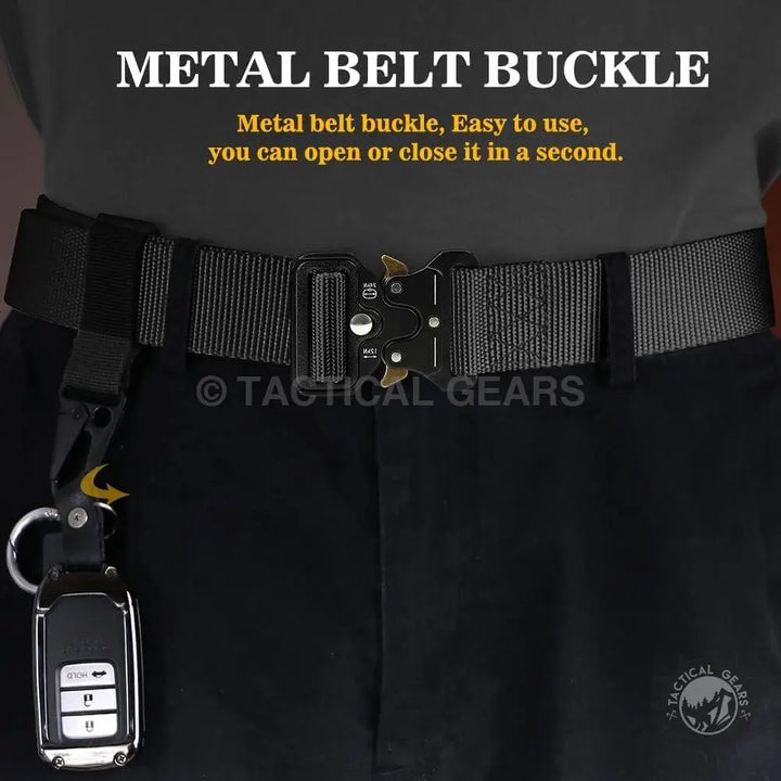 Black tactical waist belt with alloy buckle holding a car key fob via carabiner