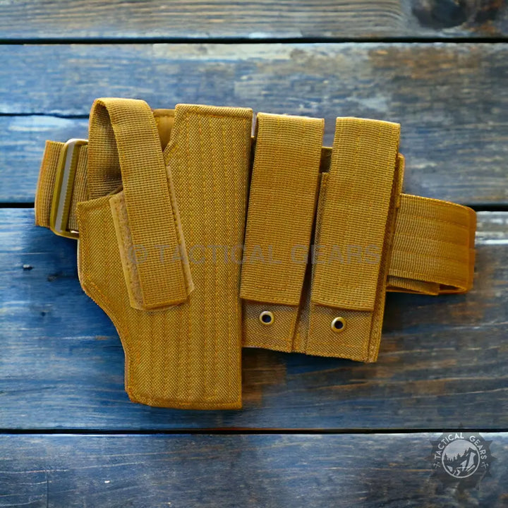 Tan tactical belt with waist holster and magazine pouches for concealed carry