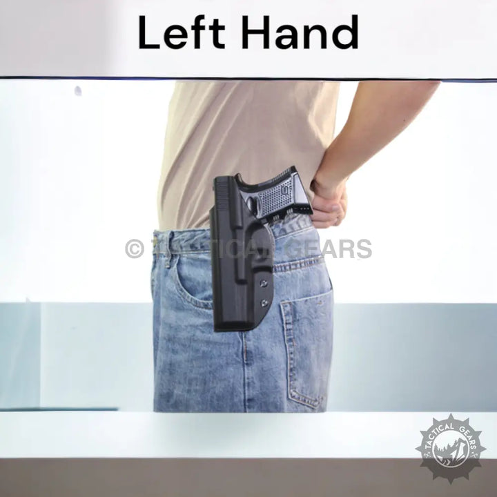 Black plastic waistband pistol case holster attached to blue jeans waistband for secure carry
