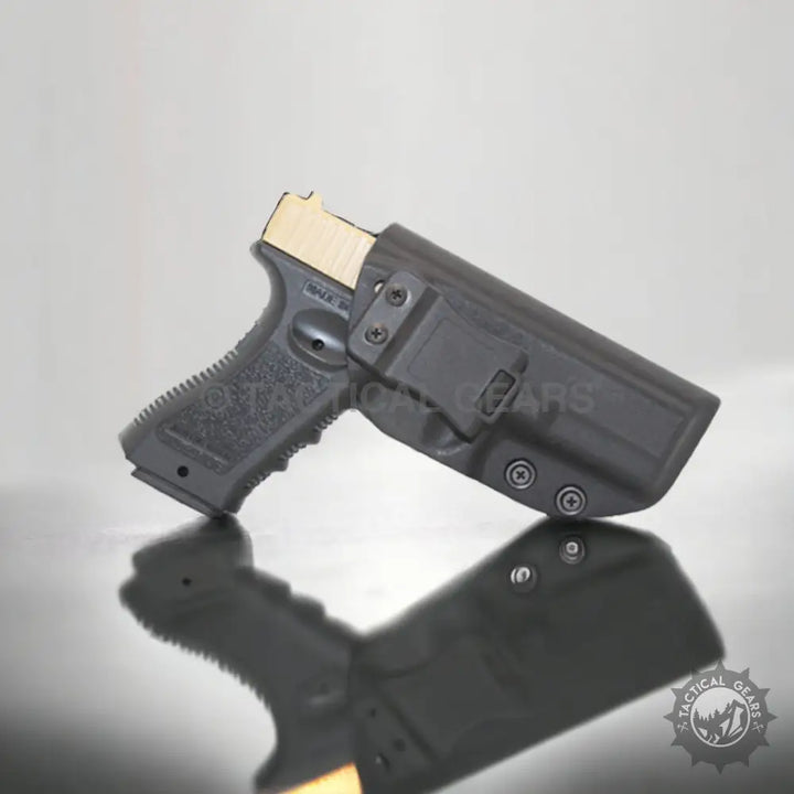 Black pistol with tan slide in waistband pistol case holster for secure concealment