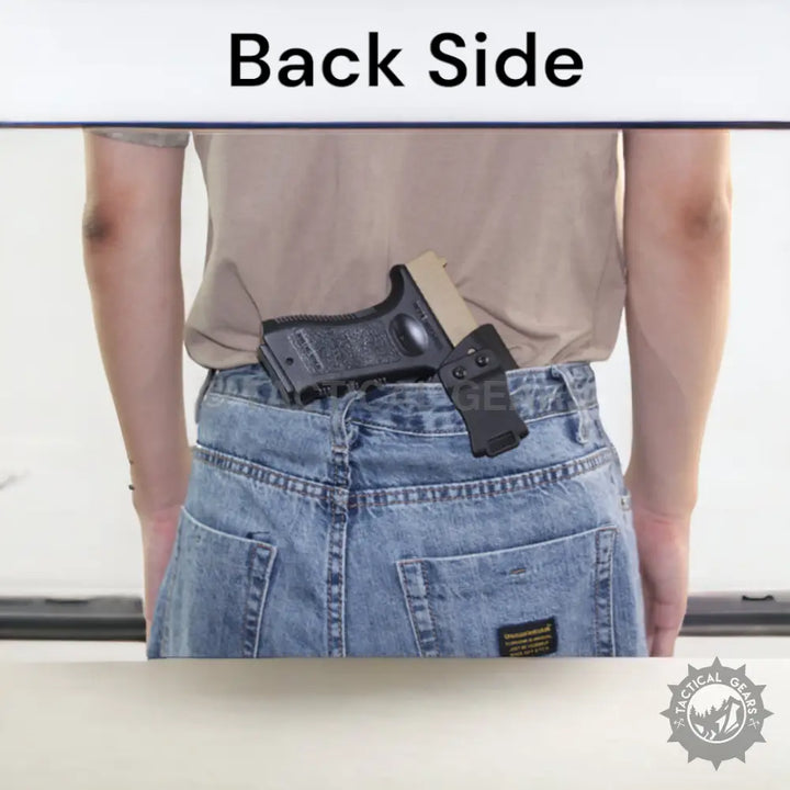 Black pistol with tan slide in waistband pistol case holster tucked into blue jeans