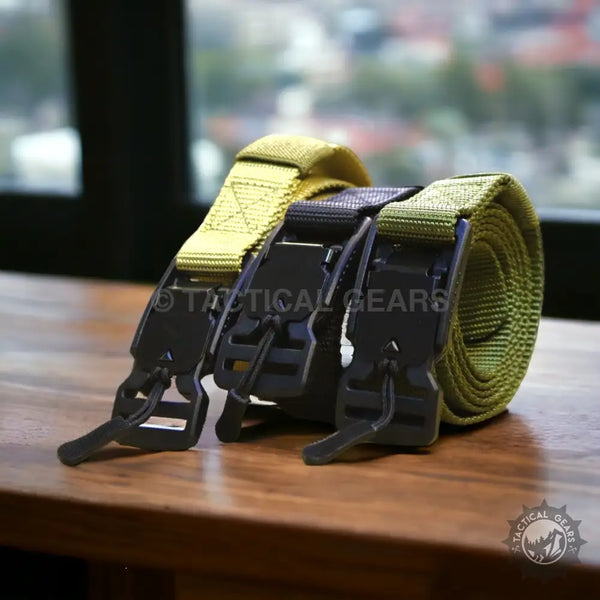 Three rolled tactical web belts with durable black buckles for outdoor and military use