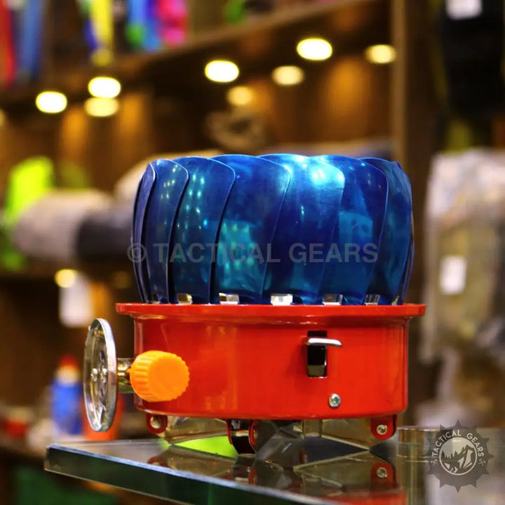 Red portable gas stove with blue flame guard for Windshield Lotus Camping Stove and camping stove use