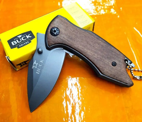 Buck USA X75 Classic Mini Knife with dark wooden handle and black blade for collection